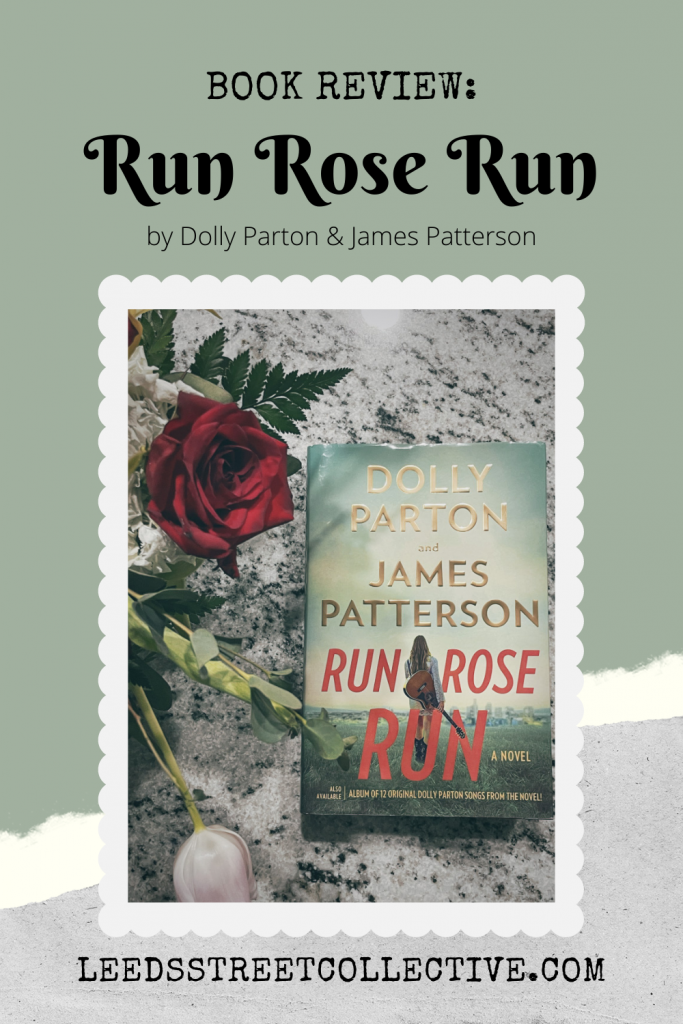 photo of the book Run Rose Run by Dolly Parton and James Patterson sitting on a countertop with red roses and pink tulips in a vase next to it