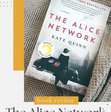 close up of the cover of The Alice Network by Kate Quinn laying on a gray striped pillow with a gray waffle blanket